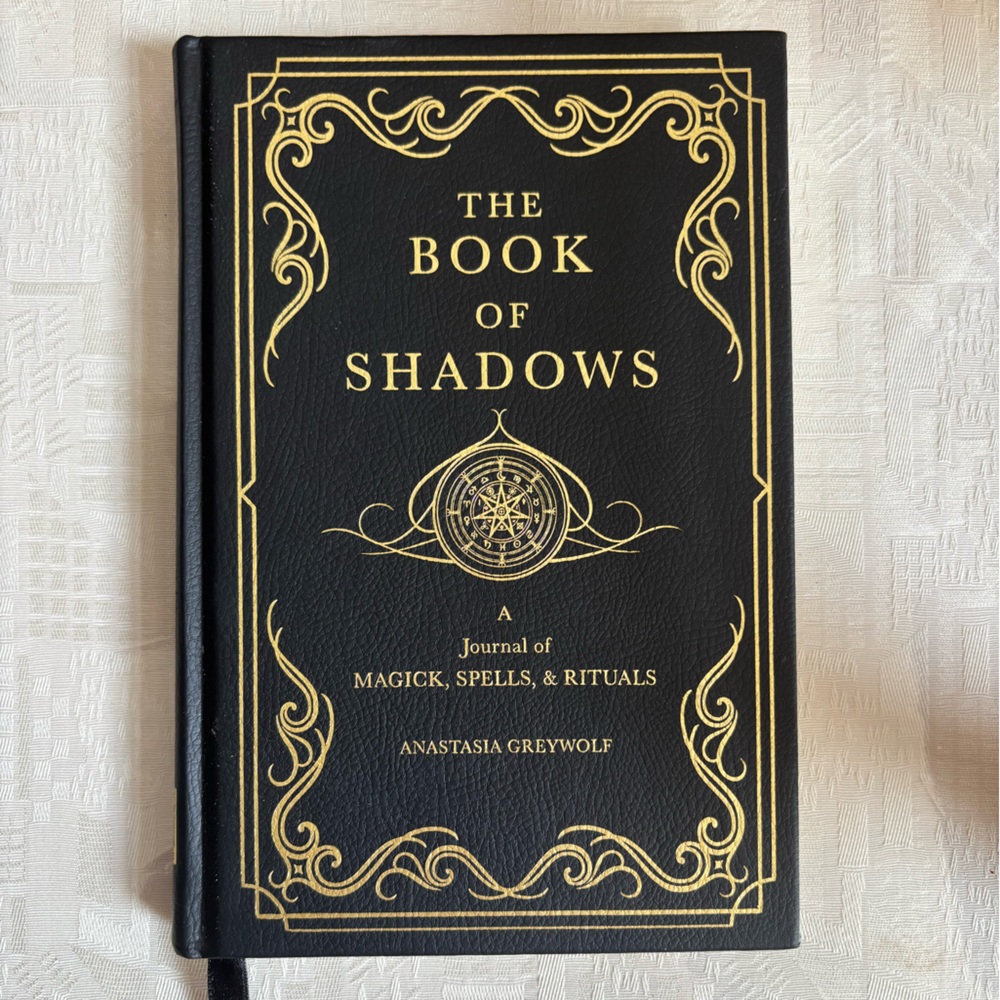 The book of shadows a Journal of Magick,spells and rituals by Anastasia Greywolf